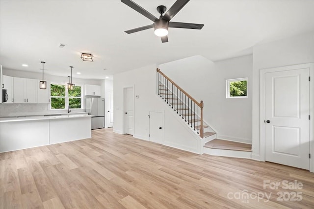 605 Poplar St, Shelby, NC 28150 - unfurnished living room featuring stairway, ceiling fan, light wood-style flooring, recessed lighting, and baseboards
