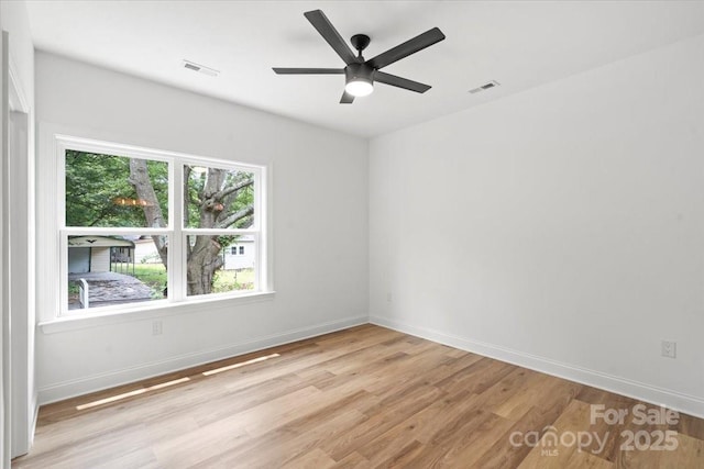 605 Poplar St, Shelby, NC 28150 - empty room with light wood-type flooring, baseboards, and a ceiling fan
