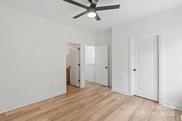 605 Poplar St, Shelby, NC 28150 - unfurnished bedroom with light wood-type flooring, baseboards, ensuite bathroom, and a ceiling fan