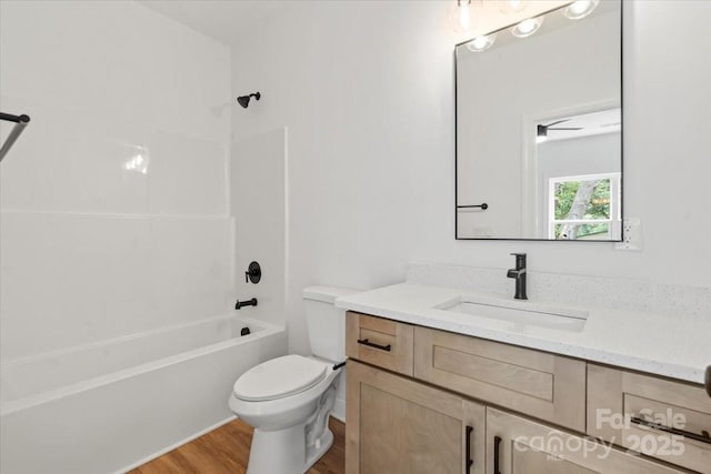 605 Poplar St, Shelby, NC 28150 - bathroom featuring vanity, wood finished floors, toilet, and bathing tub / shower combination