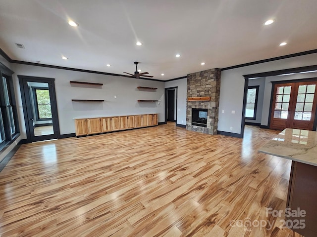 1076 Table View Dr Unit 55, Morganton, NC 28655 - unfurnished living room featuring crown molding, light wood-style floors, ceiling fan, baseboards, and recessed lighting