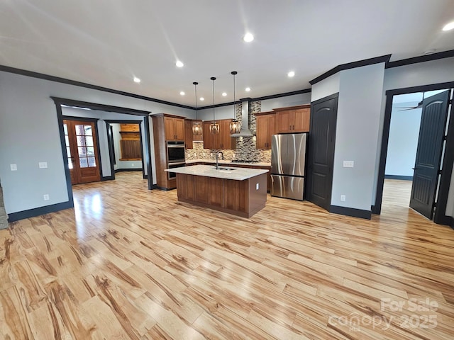 1076 Table View Dr Unit 55, Morganton, NC 28655 - kitchen with appliances with stainless steel finishes, wall chimney range hood, light countertops, ornamental molding, and light wood-type flooring