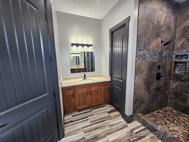 1076 Table View Dr Unit 55, Morganton, NC 28655 - full bathroom with vanity, tiled shower, and wood finished floors