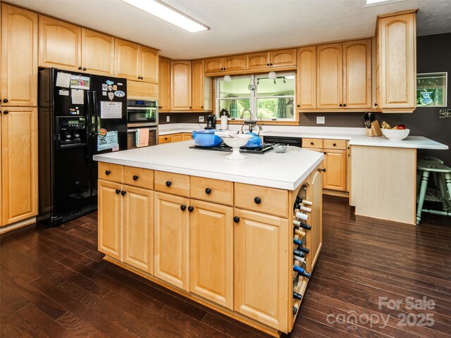 26 Melton Rd, Candler, NC 28715 - kitchen featuring black refrigerator with ice dispenser, dark wood-style flooring, light brown cabinetry, and light countertops