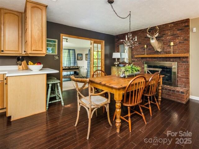 26 Melton Rd, Candler, NC 28715 - dining room with dark wood-style flooring, a fireplace, and baseboards