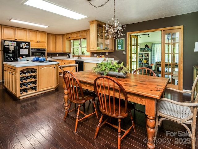 26 Melton Rd, Candler, NC 28715 - dining space with dark wood-style floors and a chandelier