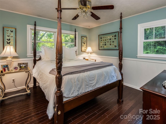26 Melton Rd, Candler, NC 28715 - bedroom with hardwood / wood-style flooring, multiple windows, baseboards, crown molding, and ceiling fan