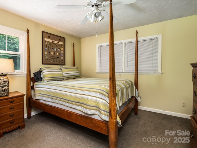 26 Melton Rd, Candler, NC 28715 - bedroom featuring dark carpet, baseboards, a textured ceiling, and a ceiling fan
