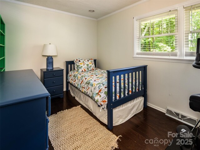 26 Melton Rd, Candler, NC 28715 - bedroom with dark wood-style flooring, ornamental molding, and baseboards