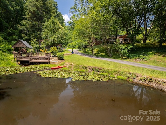 26 Melton Rd, Candler, NC 28715 - view of home's community with a gazebo, a lawn, and a water view