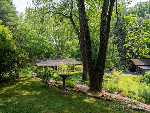 26 Melton Rd, Candler, NC 28715 - view of green lawn with a wooded view