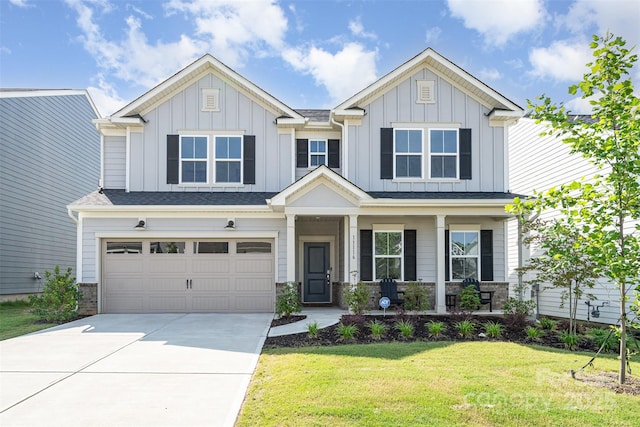 11116 Godwit Ln, Charlotte, NC 28278 - craftsman inspired home with a porch, driveway, a front yard, an attached garage, and board and batten siding