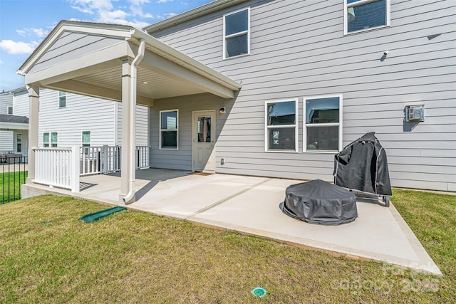 11116 Godwit Ln, Charlotte, NC 28278 - back of property with a fire pit, a patio, and a lawn