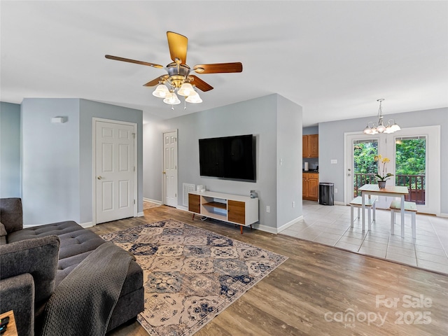 17 Fieldtop Ln, Arden, NC 28704 - living area featuring ceiling fan, a chandelier, and light wood-style floors