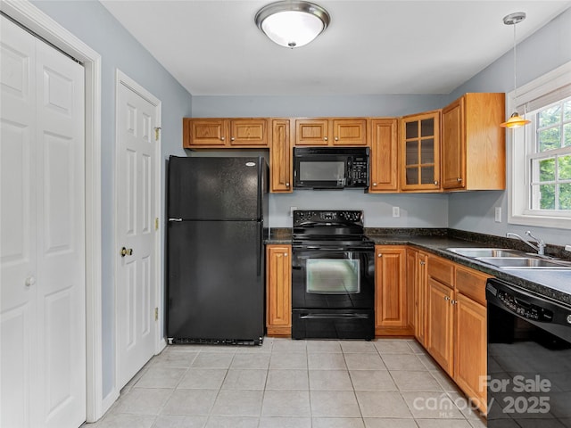 17 Fieldtop Ln, Arden, NC 28704 - kitchen with black appliances, dark countertops, glass insert cabinets, decorative light fixtures, and light tile patterned flooring