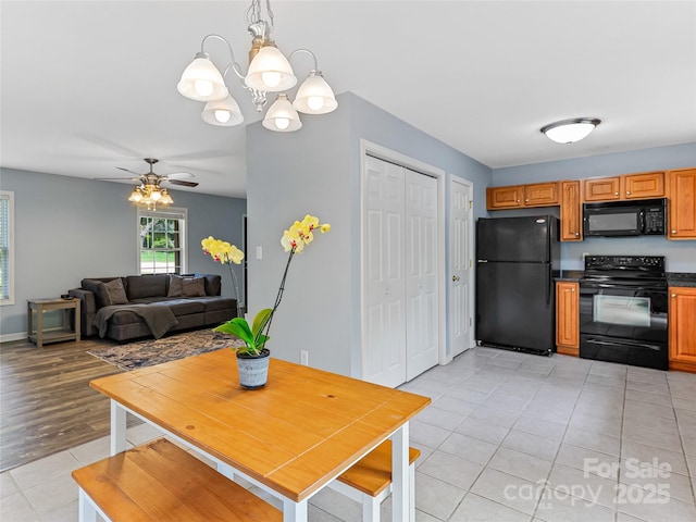 17 Fieldtop Ln, Arden, NC 28704 - dining room with light tile patterned floors, ceiling fan, and a chandelier