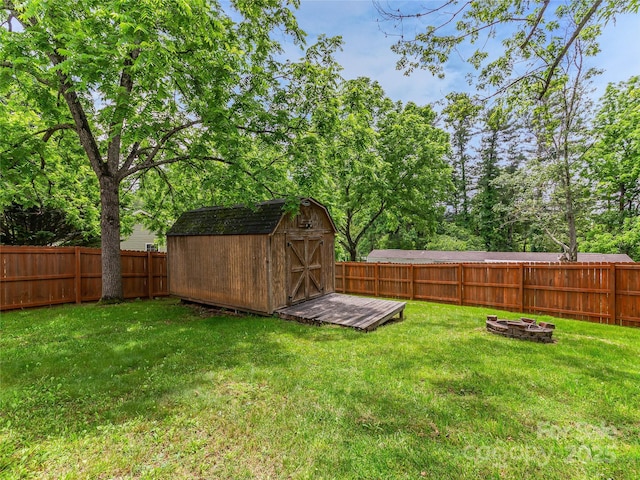17 Fieldtop Ln, Arden, NC 28704 - fenced backyard featuring a fire pit and a storage unit