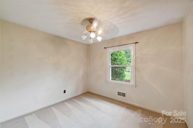 46 Donna Dale Ave SE, Concord, NC 28025 - unfurnished room with light carpet, baseboards, and a ceiling fan
