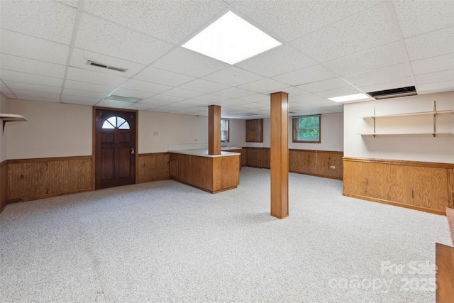 46 Donna Dale Ave SE, Concord, NC 28025 - below grade area featuring wainscoting, plenty of natural light, wood walls, and a drop ceiling