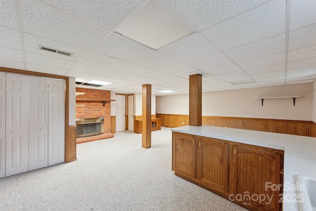 46 Donna Dale Ave SE, Concord, NC 28025 - bar area featuring a brick fireplace, wainscoting, light colored carpet, and a drop ceiling