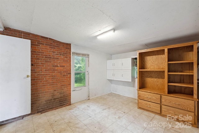46 Donna Dale Ave SE, Concord, NC 28025 - empty room with brick wall