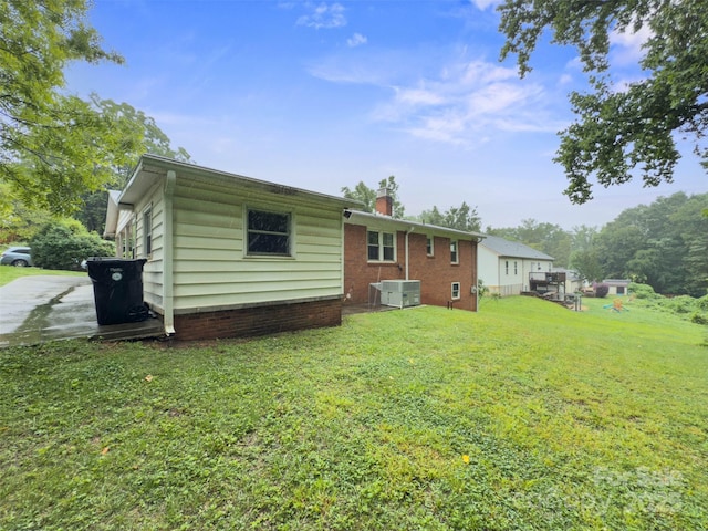 46 Donna Dale Ave SE, Concord, NC 28025 - rear view of property with a lawn and a chimney