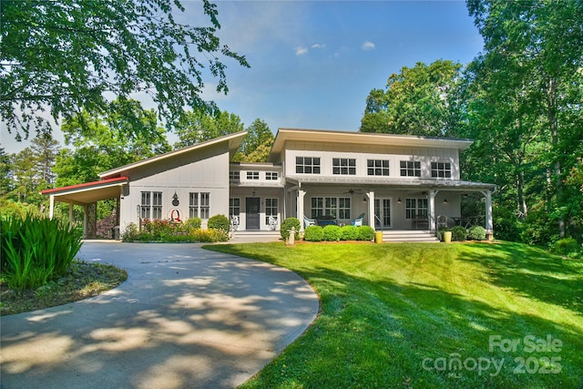 63 Greenridge Rd, Weaverville, NC 28787 - view of front facade with a front yard, covered porch, driveway, and an attached carport