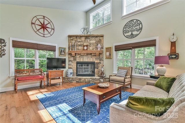 63 Greenridge Rd, Weaverville, NC 28787 - living area featuring a high ceiling, wood-type flooring, and a stone fireplace