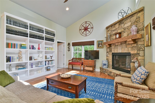 63 Greenridge Rd, Weaverville, NC 28787 - living area featuring high vaulted ceiling, wood finished floors, a fireplace, and ceiling fan