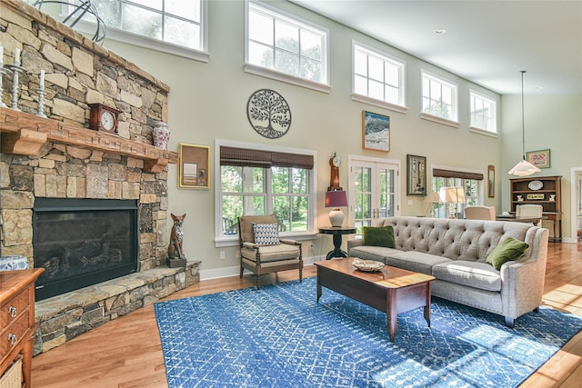 63 Greenridge Rd, Weaverville, NC 28787 - living room with a towering ceiling, healthy amount of natural light, wood finished floors, and a fireplace