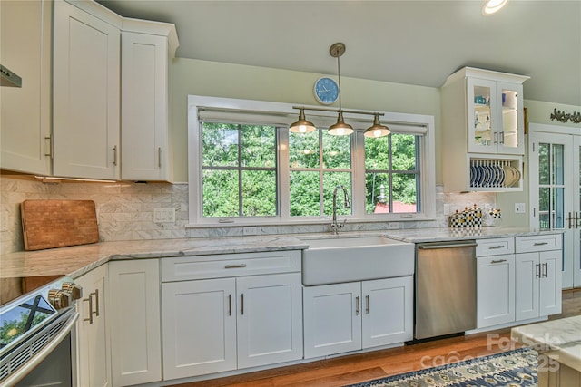 63 Greenridge Rd, Weaverville, NC 28787 - kitchen with appliances with stainless steel finishes, white cabinets, tasteful backsplash, light stone counters, and glass insert cabinets
