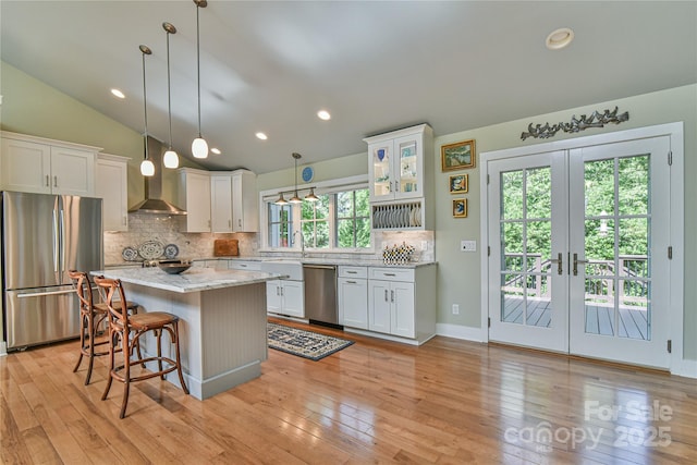63 Greenridge Rd, Weaverville, NC 28787 - kitchen with stainless steel appliances, white cabinets, tasteful backsplash, light stone counters, and a kitchen island