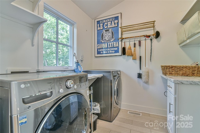63 Greenridge Rd, Weaverville, NC 28787 - laundry room with independent washer and dryer, light wood-type flooring, and cabinet space