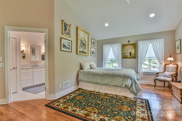 63 Greenridge Rd, Weaverville, NC 28787 - bedroom featuring light wood-style flooring, lofted ceiling, ensuite bathroom, and recessed lighting