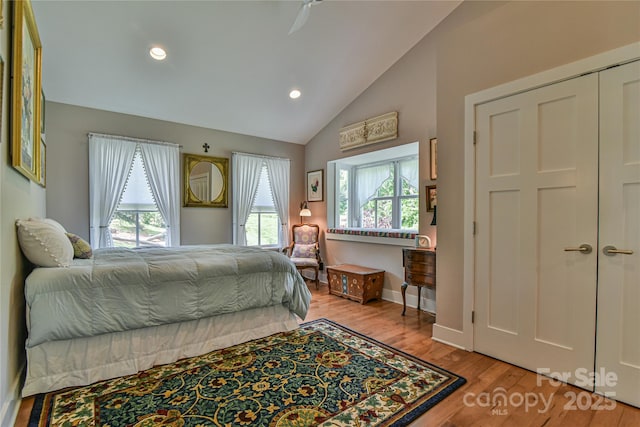 63 Greenridge Rd, Weaverville, NC 28787 - bedroom featuring multiple windows, vaulted ceiling, wood finished floors, and recessed lighting
