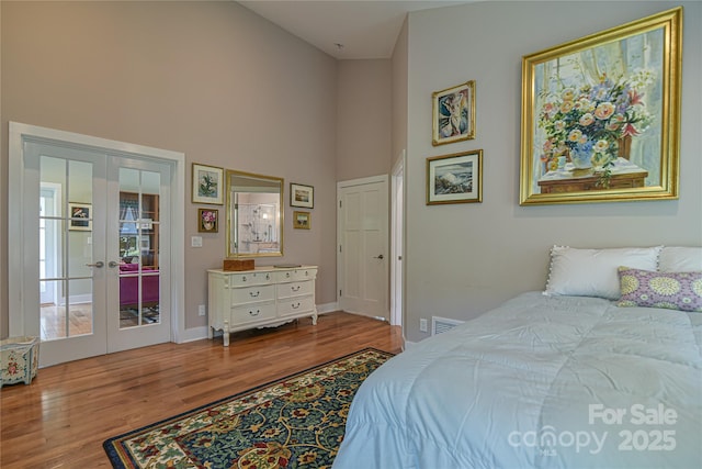63 Greenridge Rd, Weaverville, NC 28787 - bedroom with french doors, wood finished floors, and a high ceiling