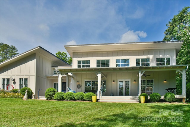 63 Greenridge Rd, Weaverville, NC 28787 - back of property featuring a ceiling fan, board and batten siding, and a yard