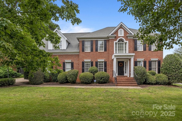 9717 Waterton Ct, Huntersville, NC 28078 - colonial inspired home with brick siding, a front lawn, and a shingled roof