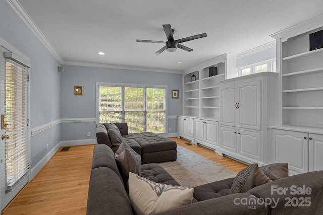 9717 Waterton Ct, Huntersville, NC 28078 - living room featuring crown molding, ceiling fan, light wood-style floors, built in features, and baseboards