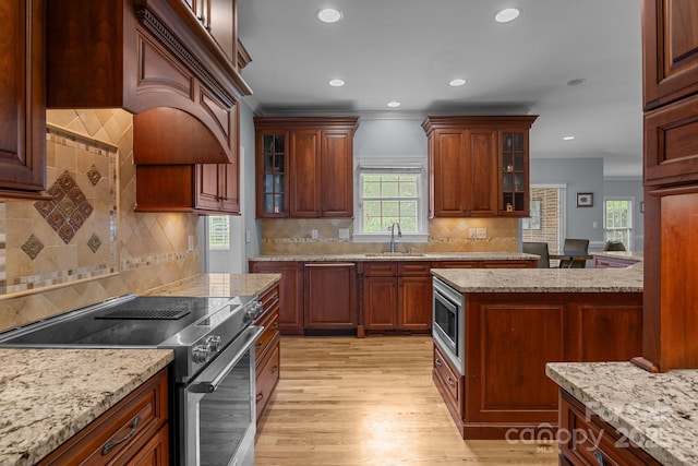 9717 Waterton Ct, Huntersville, NC 28078 - kitchen featuring range with electric cooktop, a sink, healthy amount of natural light, light wood-style flooring, and recessed lighting