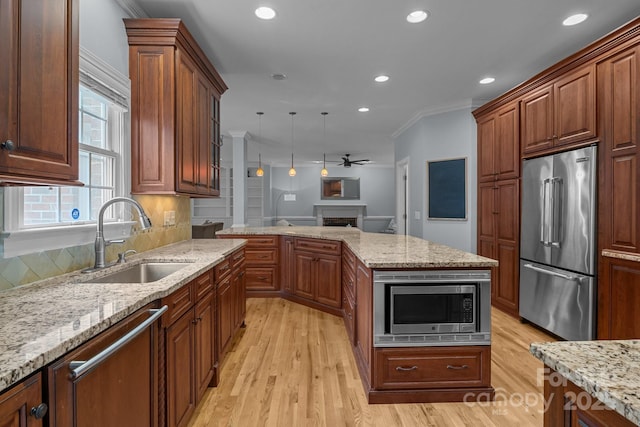 9717 Waterton Ct, Huntersville, NC 28078 - kitchen with stainless steel appliances, a sink, recessed lighting, light wood finished floors, and ornamental molding