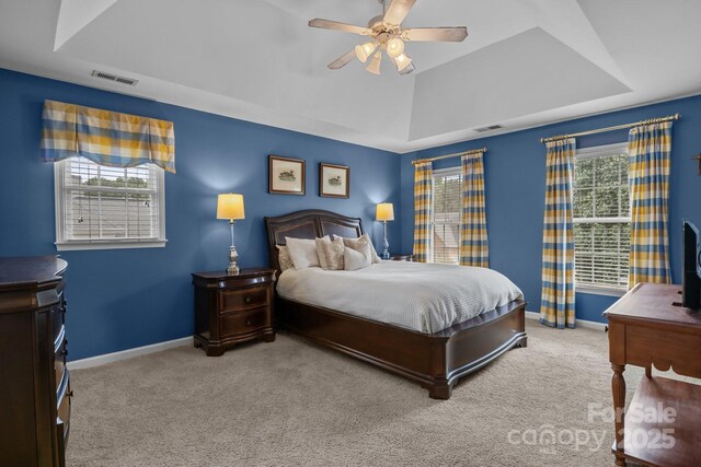 9717 Waterton Ct, Huntersville, NC 28078 - carpeted bedroom featuring a raised ceiling, baseboards, and a ceiling fan
