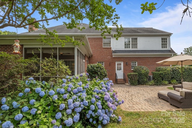 9717 Waterton Ct, Huntersville, NC 28078 - rear view of house featuring brick siding and a patio area