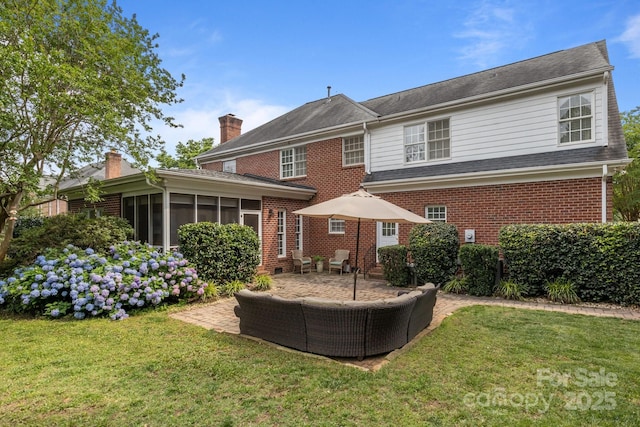 9717 Waterton Ct, Huntersville, NC 28078 - rear view of property with a chimney, a patio area, a sunroom, brick siding, and a lawn