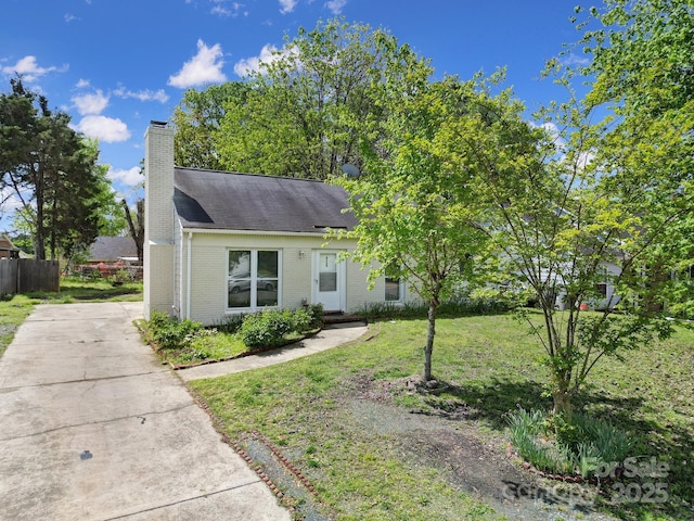 8520 Mission Hills Rd, Charlotte, NC 28227 - view of front of home with brick siding, a chimney, concrete driveway, and a shingled roof
