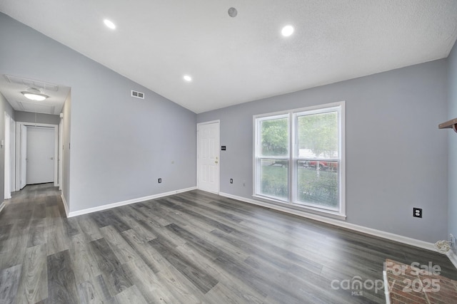 8520 Mission Hills Rd, Charlotte, NC 28227 - unfurnished living room featuring attic access, vaulted ceiling, dark wood-type flooring, and recessed lighting