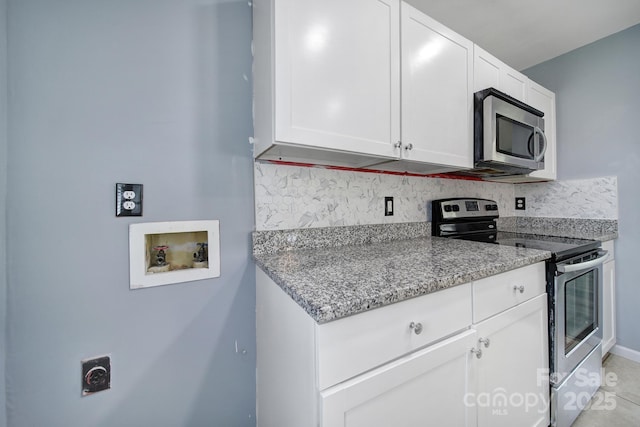 8520 Mission Hills Rd, Charlotte, NC 28227 - kitchen featuring stainless steel appliances, decorative backsplash, white cabinetry, and light stone countertops