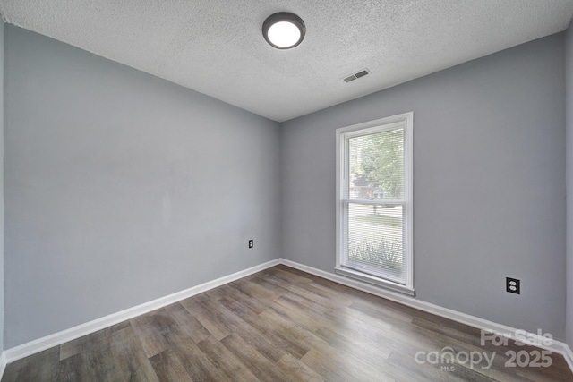 8520 Mission Hills Rd, Charlotte, NC 28227 - unfurnished room with dark wood-type flooring and a textured ceiling