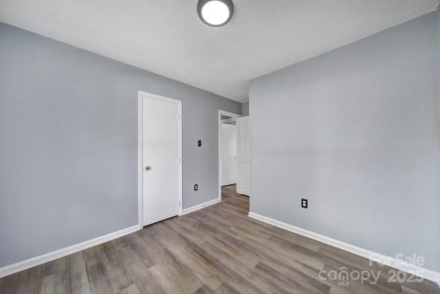 8520 Mission Hills Rd, Charlotte, NC 28227 - unfurnished bedroom with wood finished floors and baseboards