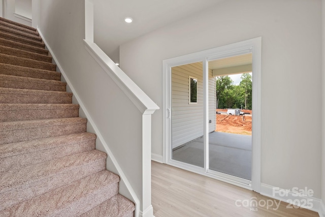 7225 Jerimoth Dr, Charlotte, NC 28215 - stairway with wood finished floors, baseboards, and recessed lighting